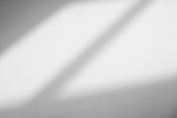 Abstract light reflection and grey shadow from window on white wall background. Gray window shadows and sunshine stripe diagonal geometric overlay effect for backdrop and mockup design