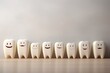 © Odesza - teeth happy family isolated light background. Smiling tooth with faces