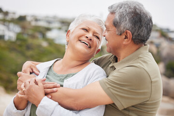 Poster - Senior, couple and hug on beach for travel, vacation or holiday with happiness or relax in nature outdoor. Elderly, man or woman in retirement at ocean or sea for peace, freedom or adventure or smile