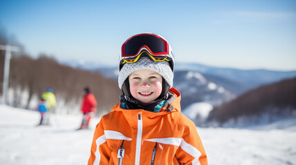 Sticker - Portrait of a kid skier in helmet and winter clothes on the background of snow-covered mountain slope