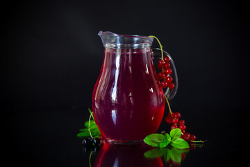 Wall Mural - Cold refreshing drink from fresh summer berries in a decanter.