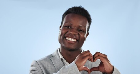 Poster - Hands, heart shape or portrait of black man in studio for support, love and charity on a blue background. Happy African entrepreneur person with emoji icon for care, business motivation or kindness
