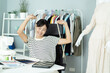 © DG PhotoStock - Happy beautiful Asian young woman working in the fashion design studio, professional female fashion designer portrait in design studio.