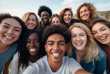 Fototapeta  - A large multiethnic group of young people take a selfie.