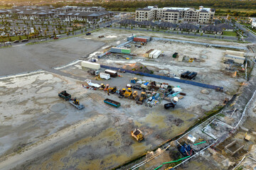 Prepared for building works construction site with many equipment in american rural area. Development of residential housing in US suburbs