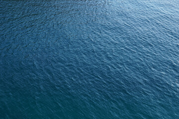 Bluish sea surface with rippled waves on the top