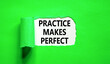 Leinwandbild Motiv Practice makes perfect symbol. Concept words Practice makes perfect on beautiful white paper. Beautiful green background. Business practice makes perfect concept. Copy space.