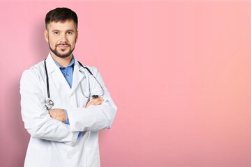 Wall Mural - Image of young doctor smiling on color background.