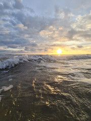 Wall Mural - ocean wave on colorful dramatic sky background
