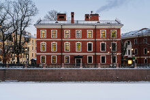 View Of A Brick Building, Formerly The Commandant's House, On The Island Of New Holland On The Banks Of The Moika River On A Winter Day, St. Petersburg, Russia