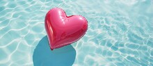 Rose Heart Buoy Floats In The Pool Seen From Above