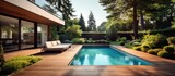 Fototapeta  - Contemporary home with pool and wooden deck