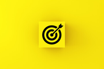 Wall Mural - business target goals and objectives. target goal symbol on a yellow cube block.