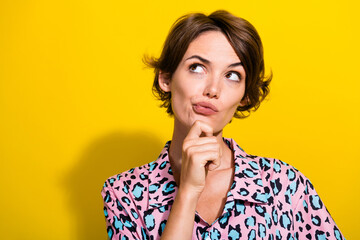 Sticker - Portrait of pensive minded person hand touch chin look empty space contemplate isolated on yellow color background