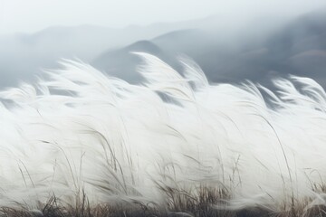  A background image showcasing windswept reeds with majestic mountains in the distance, creating a picturesque setting for a variety of creative projects. Photorealistic illustration