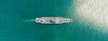 Amphibious Assault Ship. Navy Aircraft Carrier Aerial Top View Of Battleship, Military Sea Transport, Military Navy Rescue Helicopter On Board The Battleship Deck