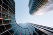© Westend61 - Spain, Catalonia, Barcelona, Directly below view of modern glass skyscraper