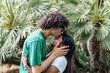 © Westend61 - Affectionate boyfriend kissing girlfriend in park