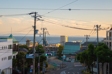 Wall Mural - 夕暮れ時の海と町並み