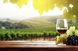 Exquisite taste wine for your romantic evening. Ripe grapes. Sunset over the vineyard. A glass of red wine on a wooden barrel.