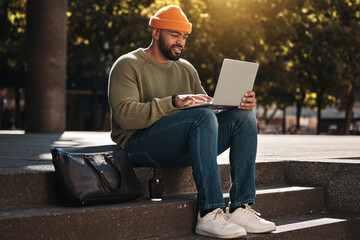 Student, man and laptop at outdoor campus for university, college or scholarship research, studying or information. African person on computer for online education, website and e learning on stairs