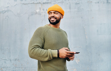 Poster - Cellphone, smile and young man by wall networking on social media, mobile app or the internet. Technology, happy and male person from Colombia scroll on website with phone in city by gray background.