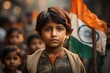 Little indian child on independence day with tricolour flag in the background