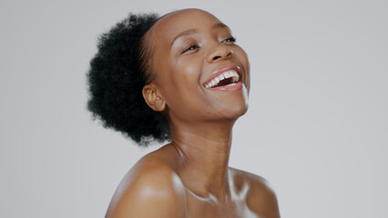 Poster - Black woman, afro and smile with beauty, skincare and healthy skin for portrait, moisturizer and blue studio background. Happy, female and sunscreen for dermatology, cosmetology and facial treatment