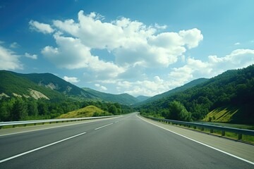 Aufkleber - A picture of an empty highway with majestic mountains in the background. Perfect for travel and adventure themes.