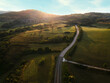 Drone view of an typical Italian hills at dawn, the sun rises against the backdrop of the Italian hills