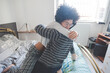 Young multiethnic couple hugging lying bed at home