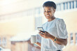 © Joshua A/peopleimages.com - Lunch, woman and coffee with cellphone at work, communication and social media for relax or break. Professional, mockup and black person with mug by window, buildings or technology for hot cappuccino