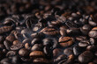 close-up of pile of coffee beans with floating smoke