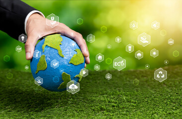 Businessman holding Earth with eco friendly icon design symbolize business company commitment to protect planet Earth's ecosystem with net zero technology and ESG practice. Reliance