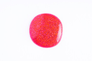 Sticker - Deep glitter pink swatch of lip gloss, cosmetic product or paint, macro. Swatches of pink lip gloss or paint on white paper background. Pink shimmer round swatch