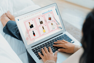 Woman shopping online on internet marketplace browsing for sale items for modern lifestyle and use credit card for online payment from wallet protected by crucial cyber security software