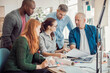 © Geber86 - Group of people working together on a project in a startup company office