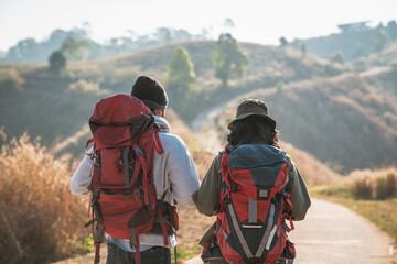 travelers hiking with backpack traveling in forest wild and look around and explore while walking in