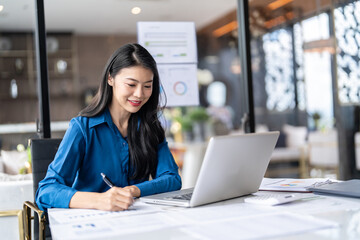 Beautiful Business Woman working by using laptop computer Hands typing on keyboard. Professional investor working new start up project. business planning in office. Technology business