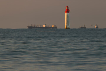 Wall Mural - Phare de Chauvea near Ile de Re with ships to La Rochelle, Pays de la Loire, France