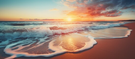 Wall Mural - Stunning ocean waves at sunrise or sunset on a tropical island beach Wonderful nature scene for a relaxing vacation