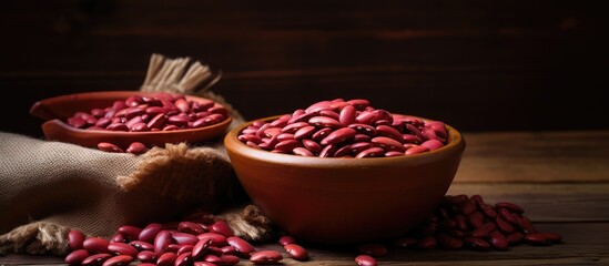 Aufkleber - Selective focus on dry adzuki beans in clay bowl on isolated pastel background Copy space en table some in focus some not