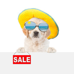 Poster - Funny Golden Retriver puppy wearing mirrored sunglasses and summer hat holds signboard with labeled 