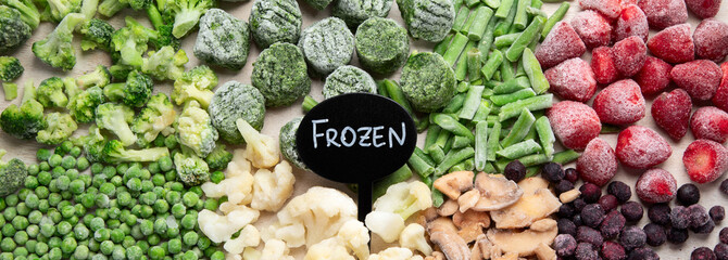 A set of foods for the winter. Various of frozen vegetables and berries