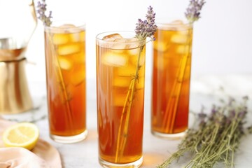 Wall Mural - tall glasses of lavender iced tea with metal straws