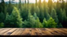 The empty wooden table top with blur background of boreal forest. Exuberant image.