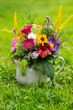 Colorful flower bouquet in a enamel pot