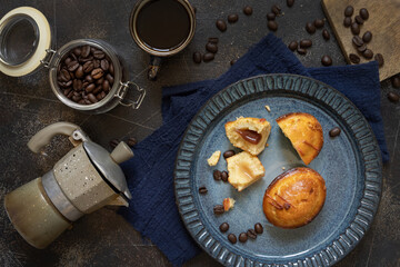 Wall Mural - Pasticciotto leccese pastries on a plate near coffe cup and moka on dark table top view