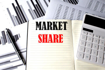 Poster - MARKET SHARE text written on a notebook on chart and diagram