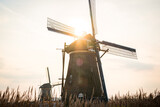 kinderdijk dutch windmill during sunrise